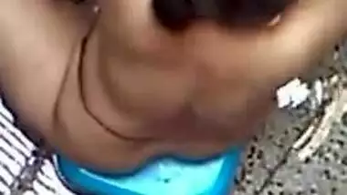 Spy XXX video of village aunty taking bath in outdoor taken by her lewd neighbor