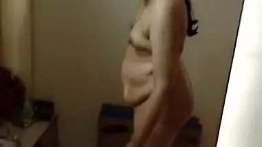 Paunchy Desi woman with small tits shows her body in the porn video