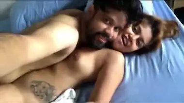 Female from India lies in bed with sex admirer with naked XXX boobs