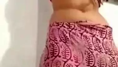 Pleasant Desi girl takes off pink dress in her first porn video