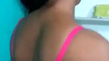 Hot like hell Desi female in sexy pink dress poses for the camera