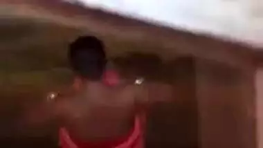 Voyeur can't take eyes off Desi girl taking a XXX shower outdoors